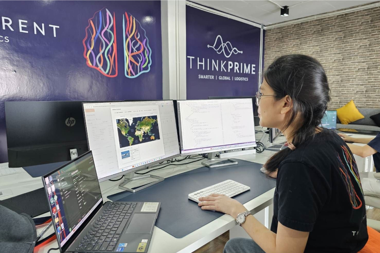 A member of the ThinkPrime team in the office, using the BlueBox Systems' platform